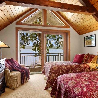 loft bedroom with lake view and balcony